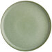 A close up of a sage green Acopa Pangea coupe plate.