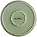 An Acopa Pangea sage matte coupe porcelain plate with a white circle on the border.