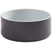 An American Metalcraft melamine bowl with a graphite exterior and white interior and rim.