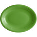 An oval palm green stoneware coupe platter with a rim, white background.