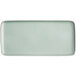 A white rectangular porcelain plate with a light blue matte finish.