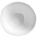 An American Metalcraft Crave white melamine bowl with a curved edge.