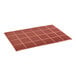 A close-up of a red rubber anti-fatigue floor mat with squares.