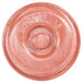 A pink polyethylene tortilla server with a circular hole on a table.