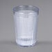 A clear plastic tumbler with a ribbed rim.