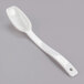 A white plastic spoon with an oval shaped bowl and a handle.