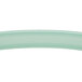 A close-up of a light green curved handle.