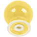 A yellow and white ceramic Fiesta pepper shaker with a white rim and swirl.
