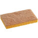 A yellow Lavex Eco sponge with brown sisal fibers on a counter.