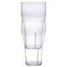 A clear plastic pebbled soda glass with a straw in it.