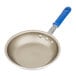 A close-up of a Vollrath Wear-Ever aluminum non-stick fry pan with a blue handle.