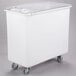 A white plastic Cambro ingredient storage bin with a sliding lid on wheels.