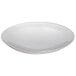 A stainless steel round platter with a rim on a white background.