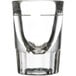 A close up of a Libbey fluted shot glass with a clear bottom and a .75 oz. pour line.