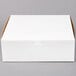 A white 12" x 12" x 4" cake box with a white lid.