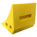 A yellow plastic block with two holes.