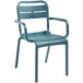 A blue Grosfillex plastic outdoor armchair with a metal frame.