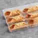 A plastic container with Brooklyn Cannoli shells inside.