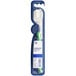 An Oral-B Sensi-Soft green toothbrush in a blue package.