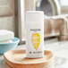 A close up of a white bottle of Pantene Pro-V Daily Moisture Renewal Shampoo.