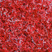 A pile of red, silver, and white Spring-Fill crinkle cut paper.