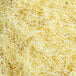 A close-up of shredded yellow paper fibers.