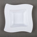 A white square bowl with a wavy design.
