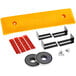 A yellow plastic Ideal Warehouse Safe-Bump forklift protector with black metal objects and red labels.