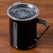 A black Cambro polycarbonate coffee mug with a lid.