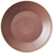 A smoky plum stoneware deep plate with a white rim.