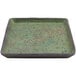 A cheforward by GET green square melamine plate with black speckled edges.