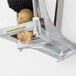 A Vollrath Redco InstaCut French Fry Cutter attached to a wall.