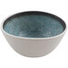A white cheforward melamine bowl with blue specks.
