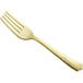 A close up of a Visions gold plastic fork with a handle.
