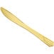 A Visions gold plastic knife with a decorative handle.