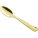 A Visions gold plastic spoon with a handle.