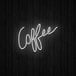 A white neon sign that says "Coffee" on a black background.