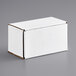 A white Lavex corrugated mailer box on a gray surface.