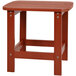 A small red faux wood table with a square top on a metal base.