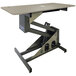 A grey Groomer's Best grooming table with a metal frame.