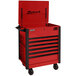 A red Homak Pro Series 7-drawer service cart with black trim and black handles.