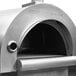 A stainless steel Pinnacolo outdoor pizza oven with a round door.