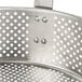 A stainless steel Vollrath Wear-Ever replacement basket with holes in it.