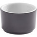 An American Metalcraft graphite melamine sauce cup with a white rim.