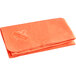 An orange Ergodyne evaporative cooling towel with a logo on it.