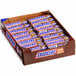 A box of SNICKERS candy bars.