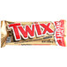 A close up of a TWIX chocolate cookie bar in a gold wrapper.