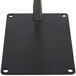 A black square metal plate with a metal post.