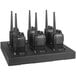 A group of six Midland BizTalk walkie talkie radios on a stand.