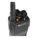 A close up of a black Midland BizTalk walkie talkie with an orange button.
